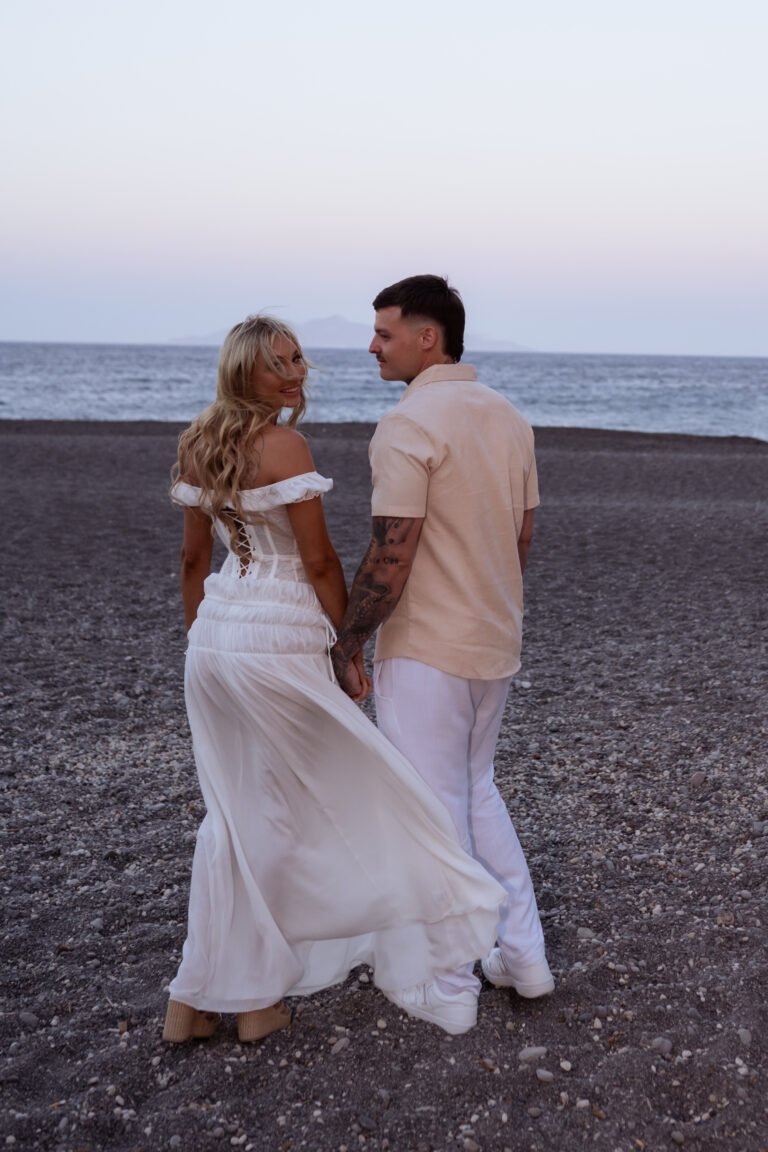 red sand beach Santorini photoshoot
